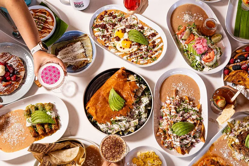 Overhead spread of chilaquiles and Mexican breakfast dishes at Cocina 35