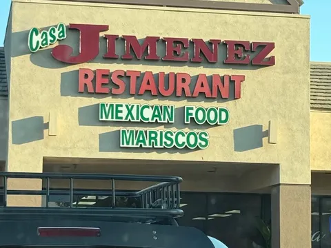 Storefront sign reading Casa Jimenez Restaurant, Mexican Food, Mariscos