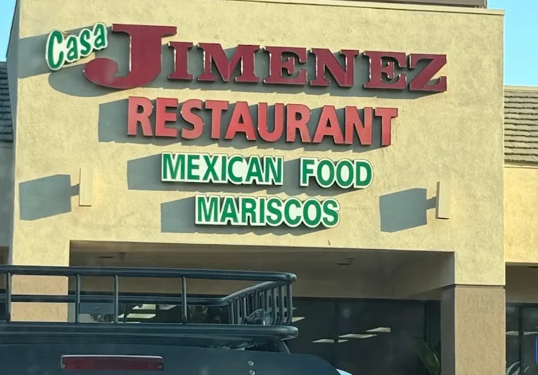 Storefront sign reading Casa Jimenez Restaurant, Mexican Food, Mariscos