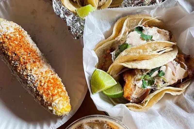 Grilled elote, a basket of fish tacos and an iced horchata cold brew from Mas Tacos Por Favor