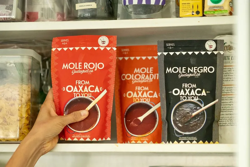 Packages of Guelaguetza mole displayed in the restaurant market