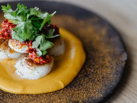 Seared scallops with carrot purée and salsa at Colita