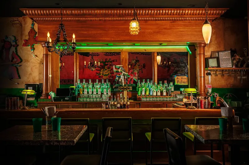 Colorful bar and dining room inside La Diabla Pozole y Mezcal
